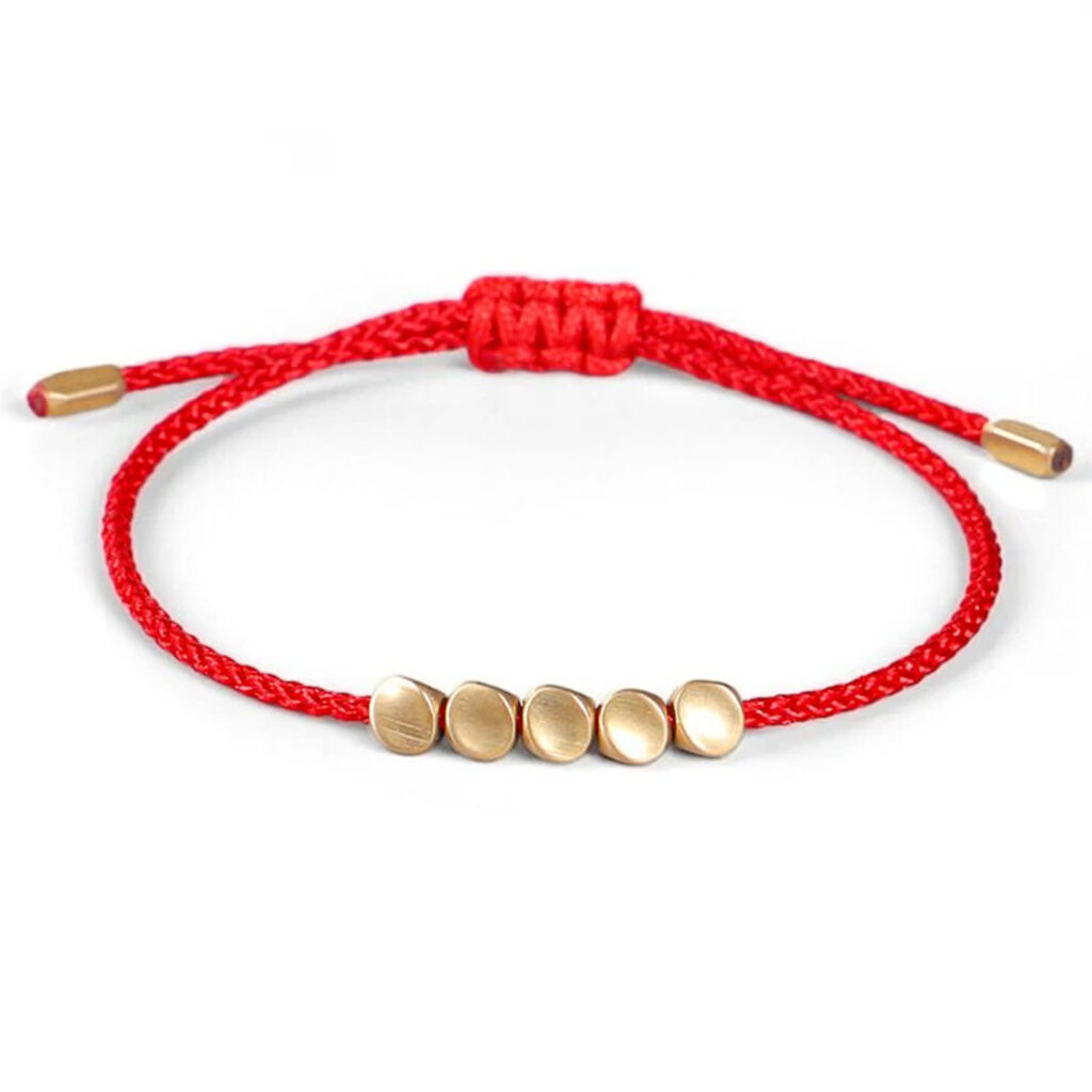 Bracelet tibétain or et fil rouge